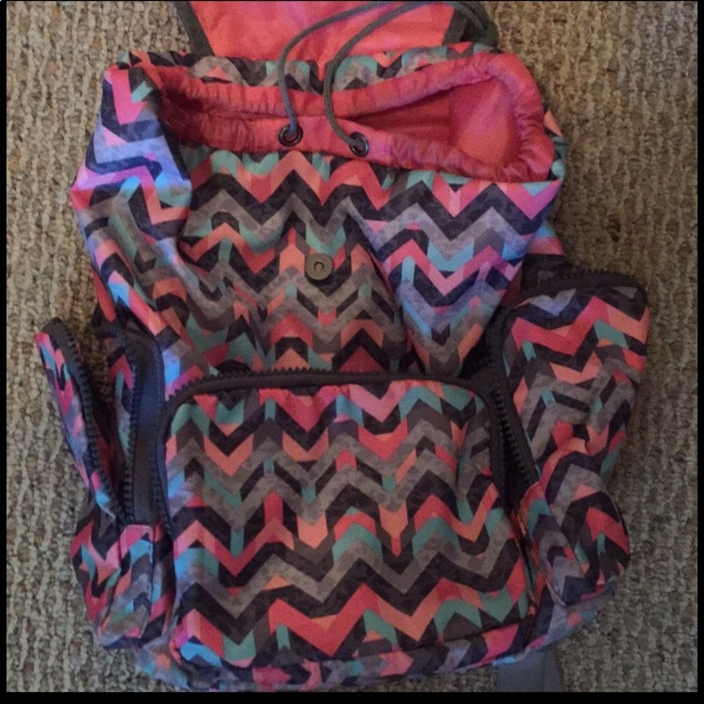 Never used super cute and trendy vinyl back pack
